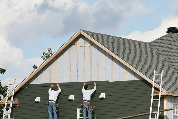 Professional Siding technician working in Ashton, MD